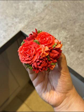 A cupcake that looks
      like a bouqet of roses