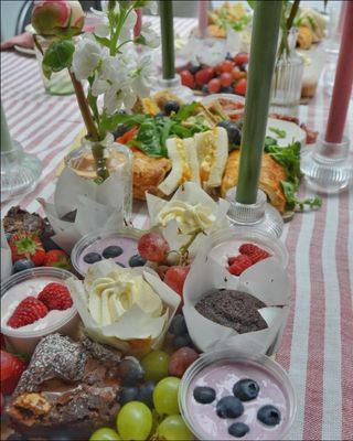 A table of fruit
      and cakes